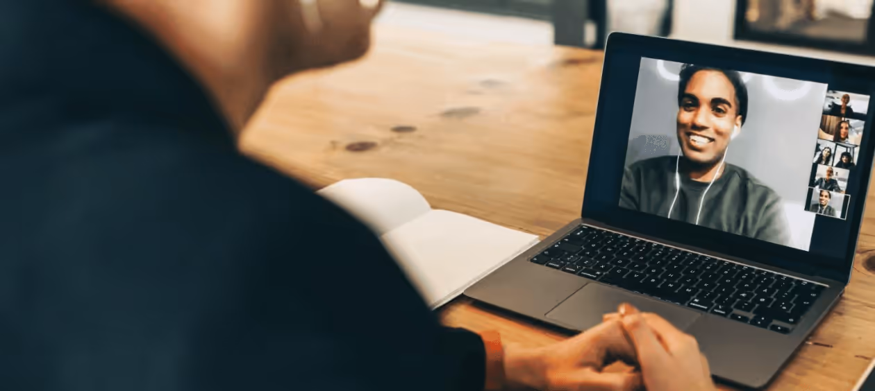 A client and Pragmatic Mortgage Lending engaging in a serious discussion about mortgage updates over a video call.